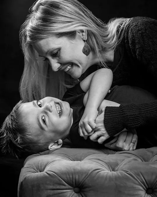 Conference speaker Amber Freed laughing with her son