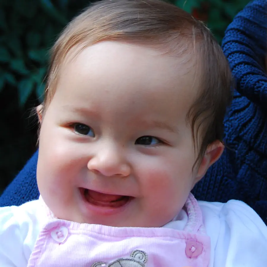 Iris as a smiling baby